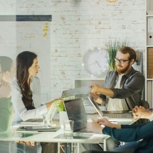 group-people-meeting-room-with-laptop-clock-wall